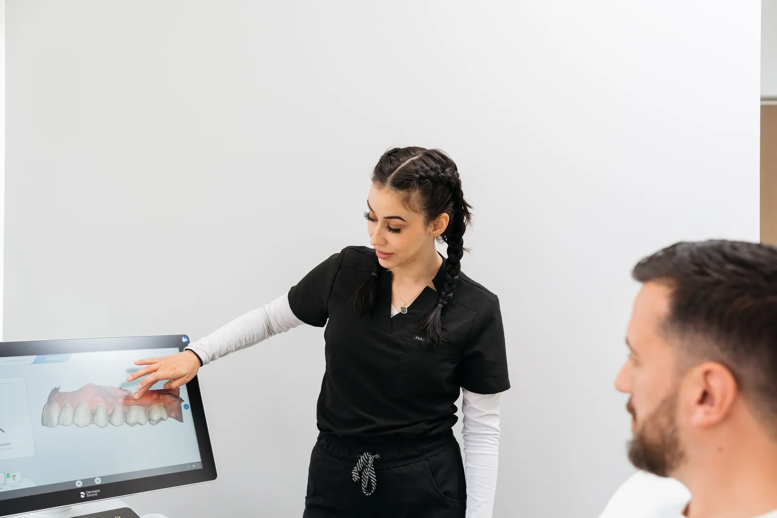 A team member explaining a digital dental scan